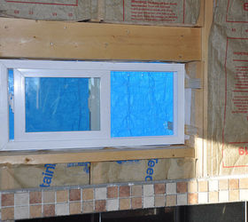 my cabin, home improvement, Window installed the blue is the tarp out side that outside wall gets siding in the spring