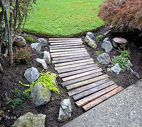 make a pallet wood walkway for your garden, diy, flowers, gardening, landscape, pallet, repurposing upcycling, Placing the planks in a slight curve as well as random alignment made for a slightly more interesting take