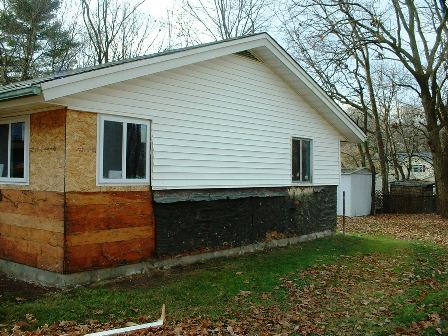 ranch flip brockton ma, Gable with new windows installed and brick removed from lower half
