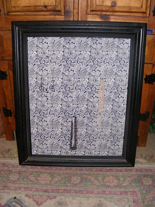 jewelry frame, I used a bold fabric but the necklaces are much easier to see in real life