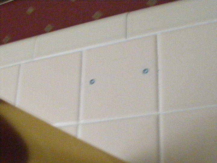 shower doors, HOLES DRILLED IN CERAMIC TILE WITH INSERTED PLASTIC ANCHORS