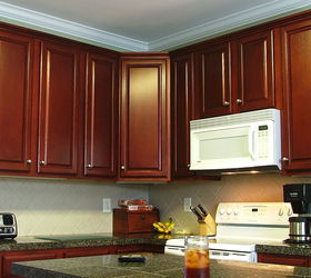 cathy saved 30 000 by refinishing her kitchen cabinets instead of replacing them, After Beautiful Cherry Finish