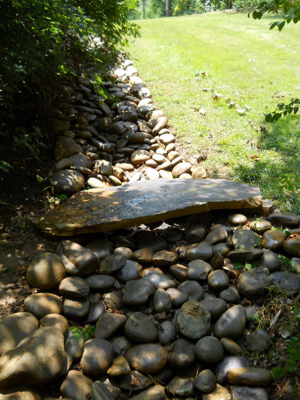 dry creek beds can be a viable and attractive alternative for drainage issues on this