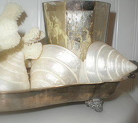 teeny tiny master bath renovation, bathroom ideas, home decor, painting, woodworking projects, Shells coral and a mercury glass candle are corralled in a vintage silver plate tray on the back of the commode to break up the vast expanse of white and add a little more style to such a tiny space