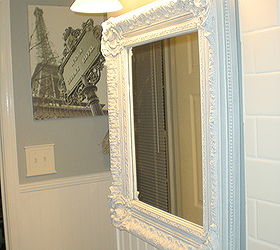 teeny tiny master bath renovation, bathroom ideas, home decor, painting, woodworking projects, I selected an over sized mirror By overlapping the wainscoting a bit it draws your eye up and keeps you from thinking how small the room is The mirror was 5 00 from Craigslist and used to be gold leafed I gave it a French Grey wash to bring out all the detail