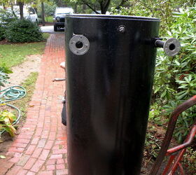 repairing a water main break, the new tank aka the black beast stands by