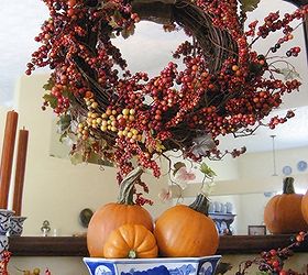 my fall mantel blue white with bittersweet and pumpkins, seasonal holiday d cor, wreaths, The wreath was made by adding a 3 50 sale faux bittersweet garland to a grapevine wreath