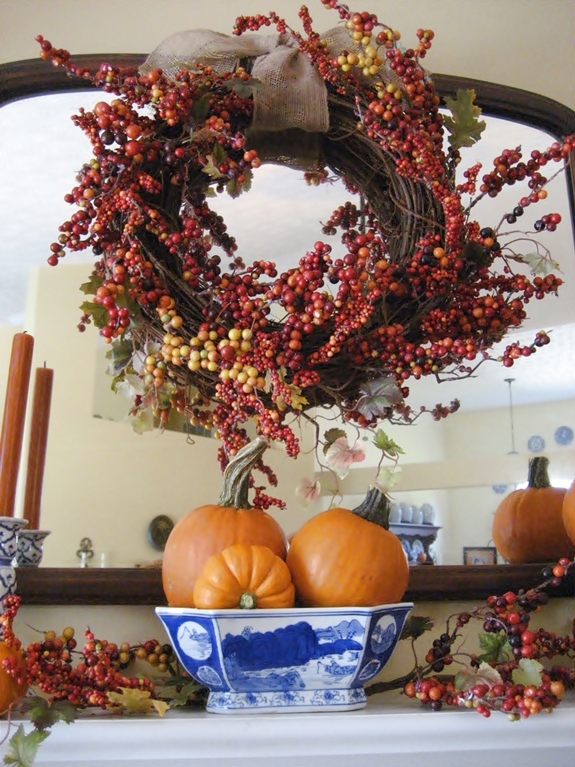 my fall mantel blue white with bittersweet and pumpkins, seasonal holiday d cor, wreaths, The wreath was made by adding a 3 50 sale faux bittersweet garland to a grapevine wreath