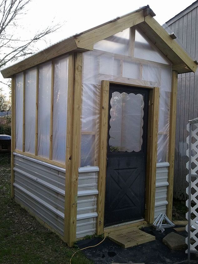 greenhouse built for less than 700, diy, gardening, outdoor living, The size is 8 x 10 and 8 high With the angle of the roofline we re going to add a hanging rod this year before fall sets in Old storm door we had in storage for front door