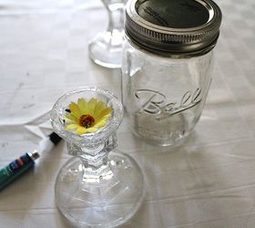 redneck wine glasses an inexpensive gift idea, crafts, repurposing upcycling, We used fabric flowers from Dollar Tree to give the base candlestick holder also from Dollar Tree a little more personality Glass glue from Michael s holds the jar to the base