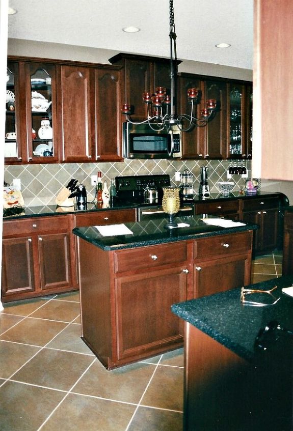 redheadcandecorate s custom built home for sale rent jacksonville fl, bathroom ideas, bedroom ideas, home decor, kitchen design, living room ideas, Huge gourmet kitchen is equipped with top of the line appliances quartz countertops mahogany stained custom cabinets and 18 inch slate ceramic tile on a diagonal which is also throughout the home including around the fireplace