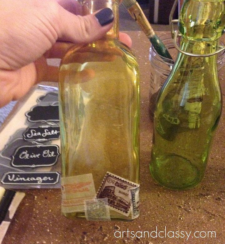 diy kitchen olive oil vineager and sea salt bottle tutorial, chalkboard paint, crafts, Once I started getting the look I wanted from the stamps layers I decided to add a Burlap Accent to paste the chalkboard label to I decided to make each bottle different with the burlap thickness You know got to change it up You