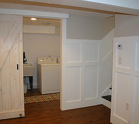 a basement update tour, basement ideas, doors, home decor, laundry room with barn door next to stairs leading back upstairs