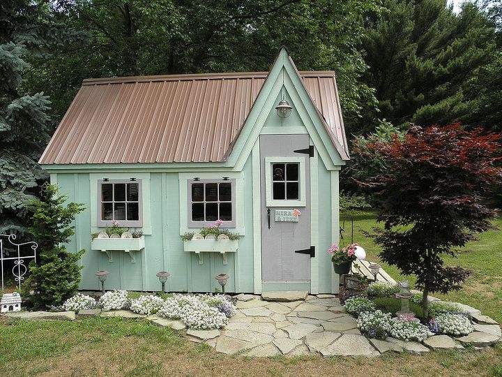 mirabella and isadora s cottage, home decor, We painted the cottage green with a lighter green for the trim and flower boxes We used lavender for other accents There is a double door with a ramp that opens to the right not in picture