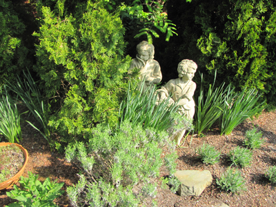 making you small outdoor space appear bigger, gardening, landscape, outdoor living, urban living, Small statues accent all of the beautiful plants