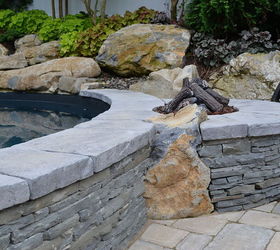 want to see an awesome pool and spa in a small backyard, landscape, outdoor living, ponds water features, pool designs, spas, Gas fire pit integrated into the pool wall using stacked bluestone and moss rock boulders