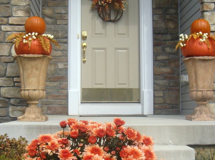 mums in a boot, gardening, repurposing upcycling, seasonal holiday decor, and secured in urns on either side of my front doorway
