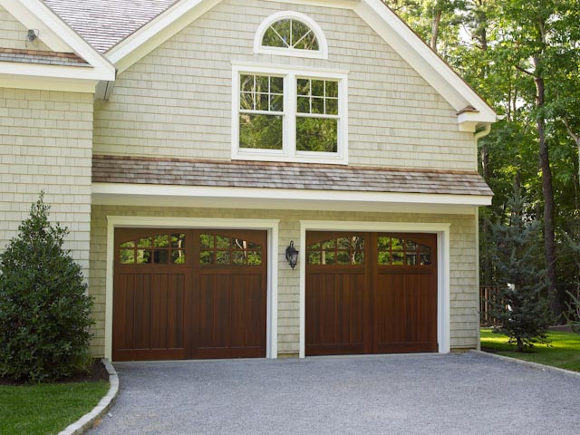wood carriage house garage doors, Clopay Reserve Collection Custom Limited Edition insulated garage door Design 4 with ARCH4 windows As seen in Traditional Home Hampton s Designer Showcase Home