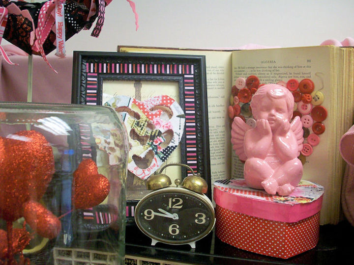 vintage glam valentine s desk vingette, crafts, seasonal holiday decor, valentines day ideas, wreaths, This little cherub got a pink makeover like its little friend over on the tray did and the fabric reappears again covering a wood heart that I floated over a framed image of the Eiffel Tower from scrapbook paper