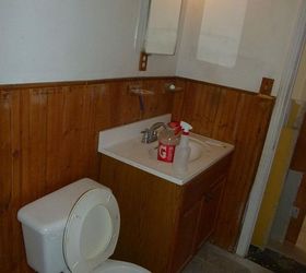 bathroom remodel, bathroom ideas, home improvement, BEFORE Nasty The whole bathroom was surrounded by this cheap wainscoting look Made it feel too much like a camp