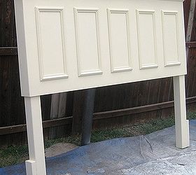 king size headboard made from an old door, doors, home decor, repurposing upcycling, King size door headboard made from and old door panels on the front side skirts crown molding supported shelf and legs added Finished in a satin Popcorn white