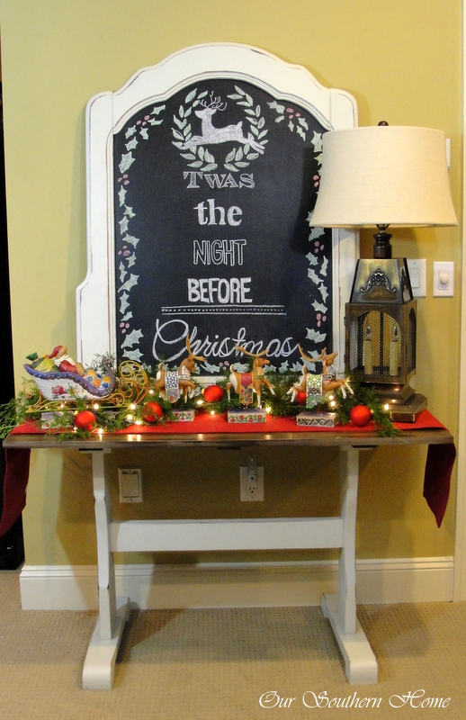 christmas chalk art vignette, christmas decorations, seasonal holiday decor, The mirror lamp and table base are from thrift stores My husband and I made the plank top for the table over the summer