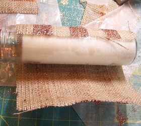 glittering striped burlap candle wraps, crafts, decoupage, seasonal holiday decor, Once the wrap is adhered to the candle with the hot glue roll the candle into the wrap