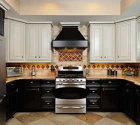 alpharetta kitchen a, home decor, kitchen backsplash, kitchen design, New contrasting Artesia style cabinetry Oyster wall cabinets with a caramel glaze and Truffle base cabinets high end crackle glass backsplash tiles LED under cabinet lights a modern dark wood and stainless ceiling fan and gorgeous Madiera Gold granite all work with a prominent stainless and black range that the owners wanted to keep
