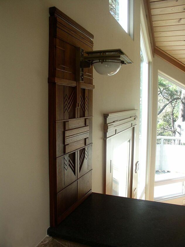 heistand designs and woodwork, products, woodworking projects, Entry door header trim and a Frank Lloyd Wright light sconce surrounded by carved walnut