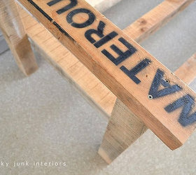make an outdoor pallet sofa that s comfy and cute, home decor, outdoor furniture, outdoor living, painted furniture, pallet, patio, Stamped board details were celebrated rather than hidden The lettering on one arm is an added quirky perk in my book And perfect to hold a requisite cup of fresh hot coffee