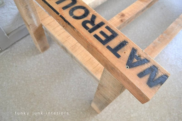 make an outdoor pallet sofa that s comfy and cute, home decor, outdoor furniture, outdoor living, painted furniture, pallet, patio, Stamped board details were celebrated rather than hidden The lettering on one arm is an added quirky perk in my book And perfect to hold a requisite cup of fresh hot coffee