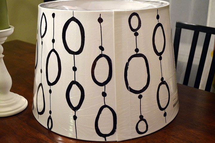 diy hand painted ikea lampshade, home decor, painted furniture, Tested out a design idea directly on the plastic wrapper of the lampshade