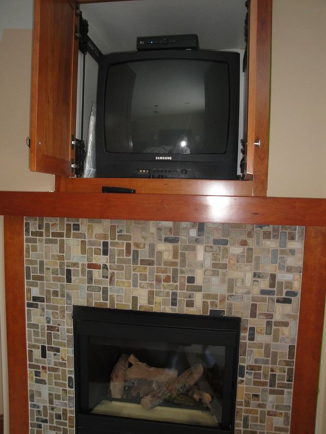i want to take off the tile and wood frame on this fireplace and put up white stacked, fireplaces mantels, home decor, tiling, how do I close this box in and put up a flat panel Want white stacked quartz on whole wall Do I tile over the tile or take if off
