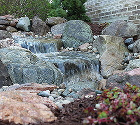 ecosystem ponds, go green, ponds water features, A close up view of the waterfalls splashing and producing peaceful sounds in Ann Arbor MI