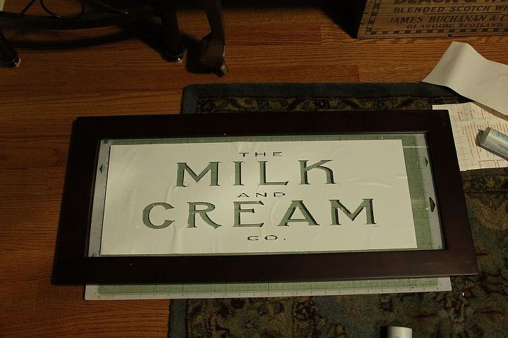 come check out my vintage milk and cream co stenciled paint on glass sign diy, crafts, home decor, repurposing upcycling, after cutting out the stencil in my silhouette I laid it out on the glass putting my cutting mat behind the glass to make it easier to line up