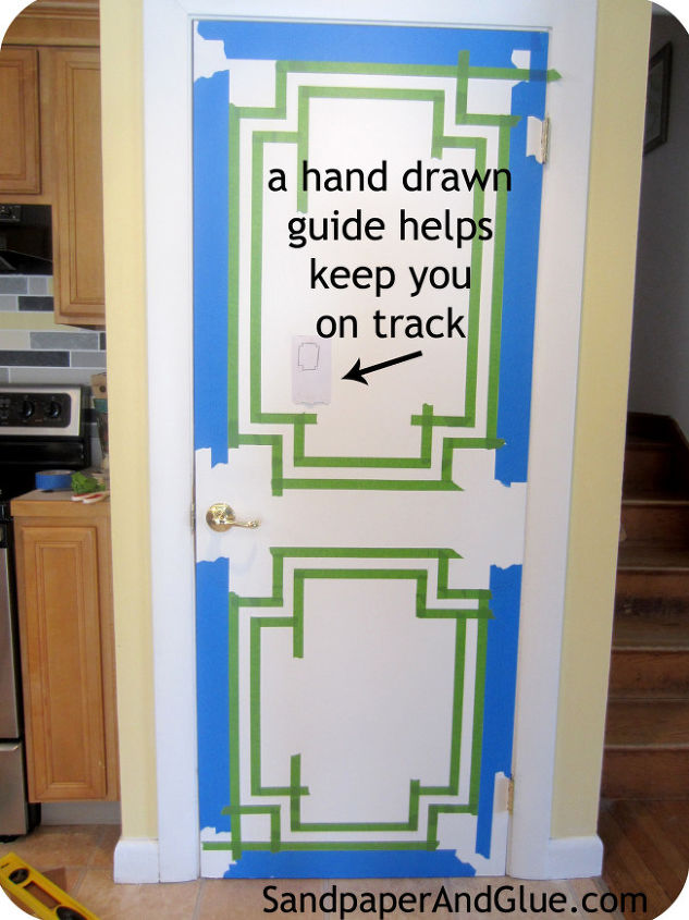 faux moulding for dummies, paint colors, wall decor, 2 strips of Scotch Blue tape made a 4 inch outline around the door 1 inch Frog Tape brought it in another inch No need to take measurements just check you are level each time you add tape