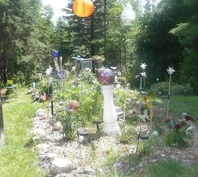 whimsical garden ideas, gardening, In this garden I have two lanterns and a mirror ball that are filled with solar rope lights