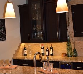 an entertaining basement remodel, basement ideas, entertainment rec rooms, home improvement, The space benefits from layered lighting including recessed lighting in the ceiling pendants above the island and dimmable undercabinet LED lighting
