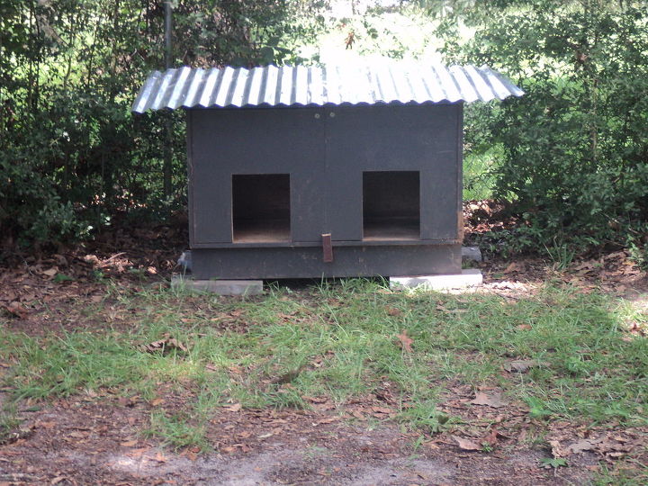 we needed a large dog house it was built from a cabinet total cost 20 00, diy, pets animals, repurposing upcycling, They cut out 2 holes for doors The original cabinet doors still open for easy cleaning Put on a latch and a roof We already had paint so it just needs to be painted TOTAL COST LESS THAN 20 00