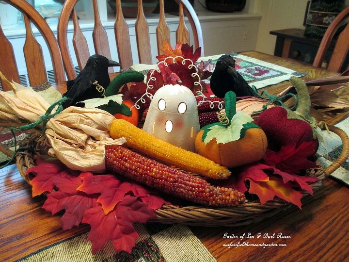 felt pumpkins in a halloween centerpiece, crafts, halloween decorations, home decor, seasonal holiday decor, Here s my Halloween centerpiece with Dollar Store ghost leaves and crows some Indian Corn and three hand sewn felt pumpkins http pinterest com barbrosen our fairfield home