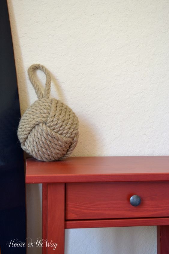 create a beach theme bedroom, bedroom ideas, home decor, Touches of red look great with the navy and white The Knotted Rope Doorstop is a great touch adding some great texture and natural fiber