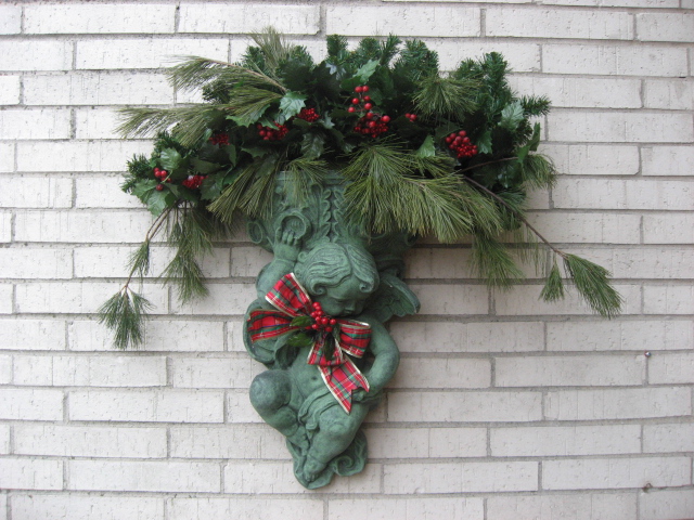 christmas front porch 2012, curb appeal, porches, seasonal holiday decor, My Mom s cherub planter It is always a special treat to decorate this I think my Mom would approve