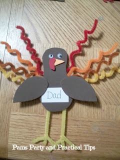 thanksgiving turkey place cards, crafts, seasonal holiday decor, thanksgiving decorations, Attachthe tear shaped wings to the body on the top side of the wing Leave the bottom of the wing loose so you can slide in a name card