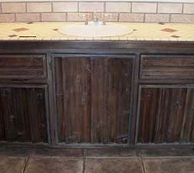 mind blowing make over of barn wood bath cabinets, bathroom ideas, diy, kitchen cabinets, painted furniture, woodworking projects, The cabinets before were super rustic barn wood that had been hard glued on to the surface of the cabinet framing