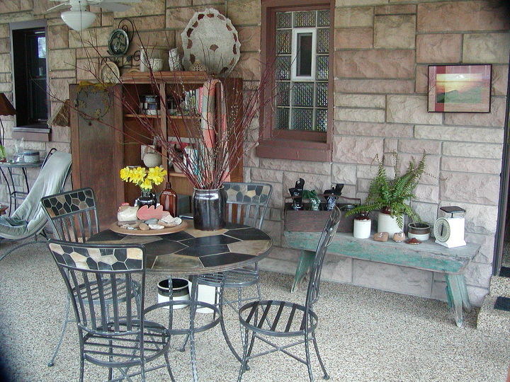 my three seasons porch decorated with mostly finds and vintage, outdoor living, repurposing upcycling, An affordable table and chair set bought at Pier One Imports is where we eat most of our meals I like that the inside wall is made of the same Indiana Limestone that frames or old Ranch house