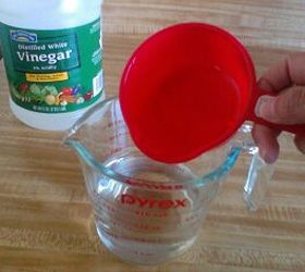 how to clean and disinfect the microwave with just vinegar and water, Step 1 Pour vinegar and water into a microwave safe measuring cup or bowl
