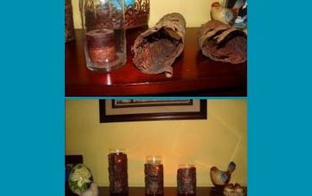 My son stripped some bark from a fallen tree.... so I wrapped some glass candle holders with them....