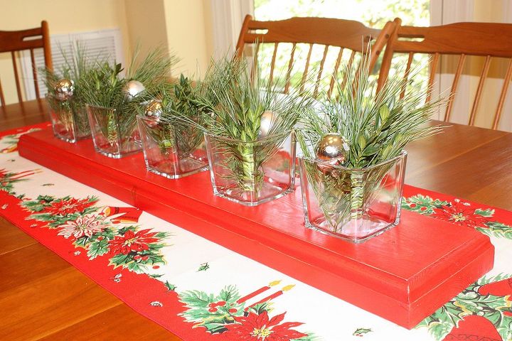 diy recessed glass votive wooden centerpiece, christmas decorations, flowers, seasonal holiday decor, woodworking projects, A vintage runner and greenery in the votives with silver balls gives the centerpiece a different look