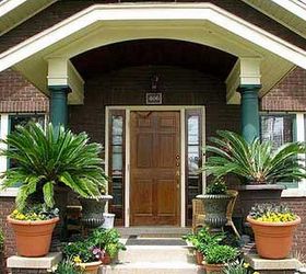 small porch pizzazz, curb appeal, outdoor living, porches, Stately plantings enhance this small bungalow porch Photo courtesy of buyamac on Flickr