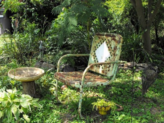 vintage metal and bouncy motel chairs in the garden, gardening, outdoor furniture, outdoor living, painted furniture, Kay Bassett s deliciously rusty motel chair full of memories
